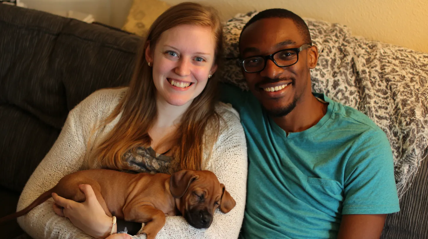 Newly adopted dog and cat relaxing together at home