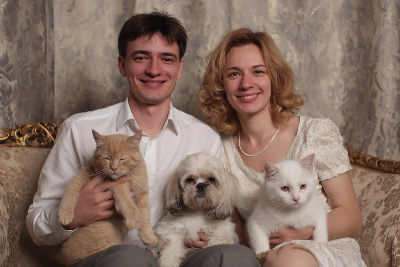 Happy family with puppy and kitten